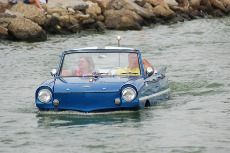 An amphicar cruises in St. Mary's Lake during the 2014 Lake Festival in Celina, Ohio.